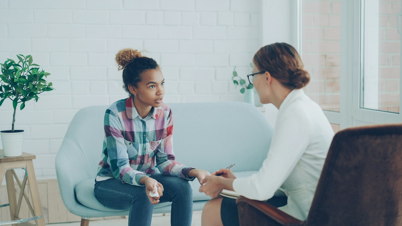 A counsellor listening closely to a client